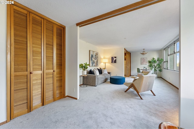 carpeted living room with a textured ceiling