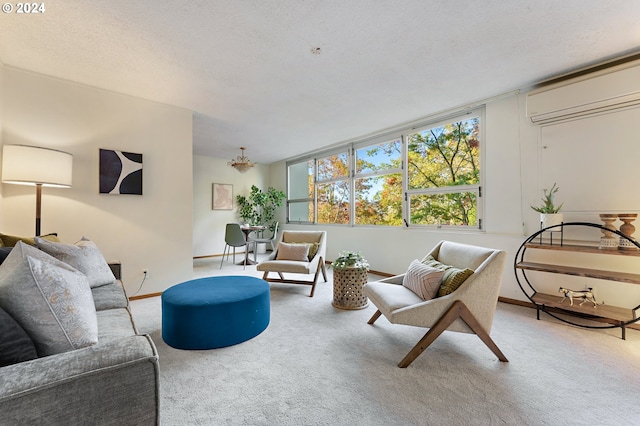 carpeted living room with a wall unit AC and a textured ceiling