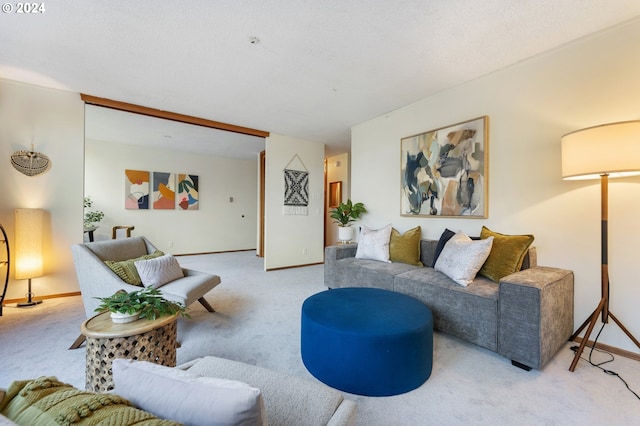 living room featuring light carpet and a textured ceiling