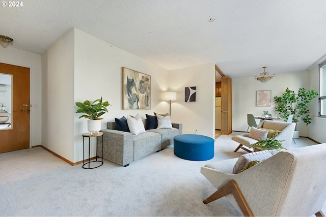 carpeted living room featuring a textured ceiling