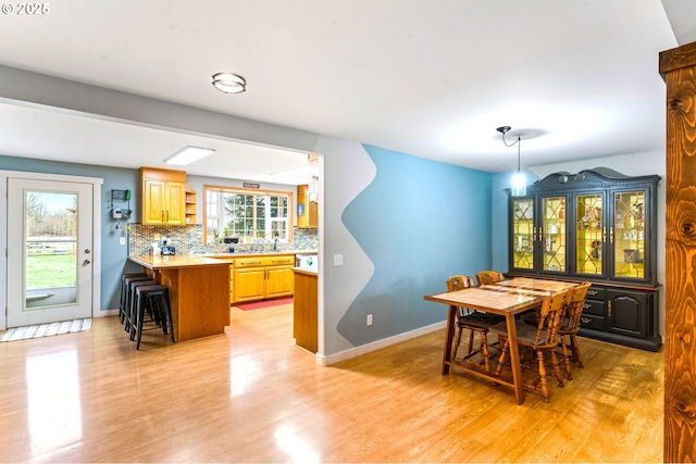 dining room with light wood-type flooring