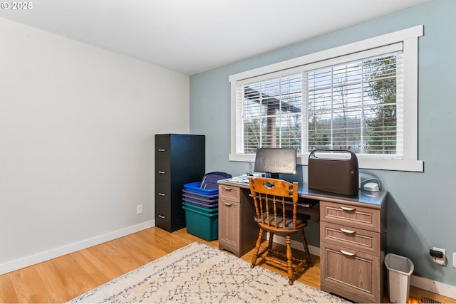 office space with light wood-type flooring