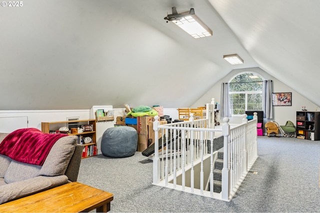 rec room with carpet floors and lofted ceiling