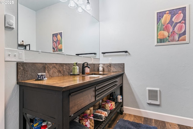 bathroom featuring vanity and hardwood / wood-style flooring