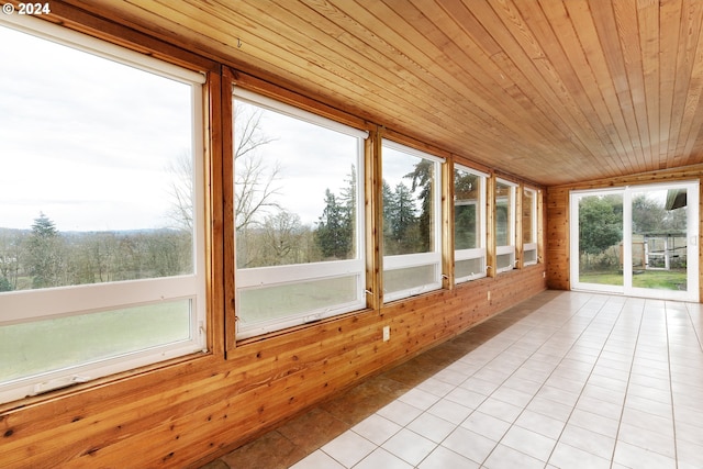 unfurnished sunroom featuring wooden ceiling