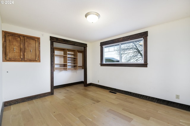 unfurnished room with light hardwood / wood-style flooring