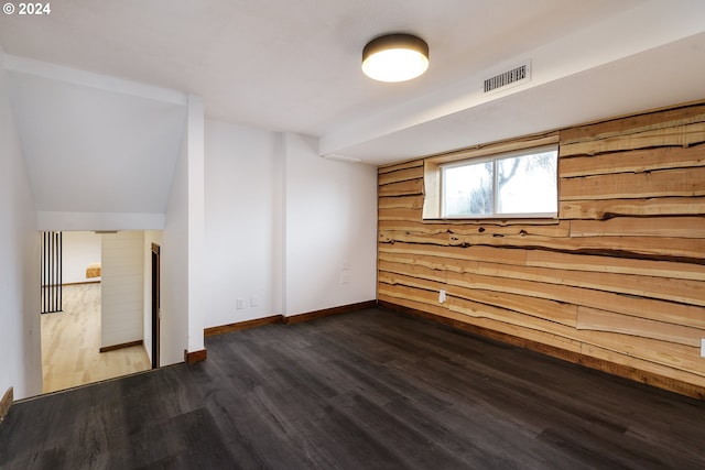 spare room with dark hardwood / wood-style flooring