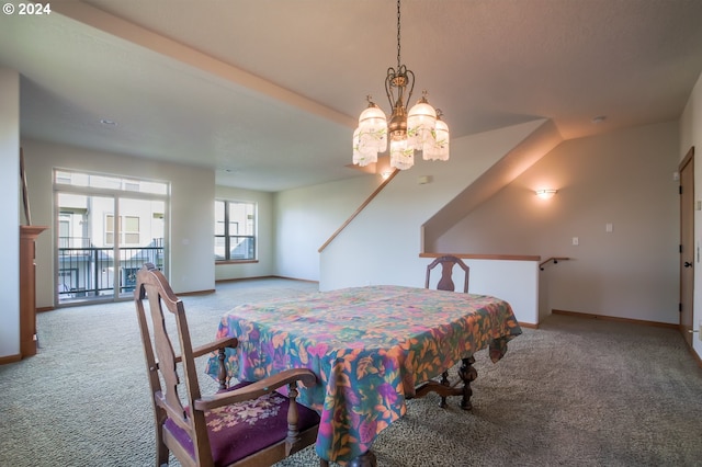 carpeted dining room featuring an inviting chandelier