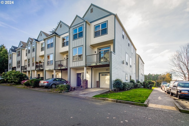 multi unit property featuring a garage