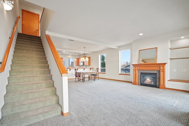 511 NE 84th Cir, Vancouver, WA 98665 - stairs with recessed lighting, carpet, baseboards, a chandelier, and a glass covered fireplace