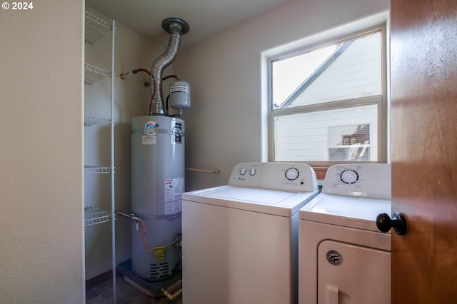 laundry room featuring secured water heater and washer and dryer