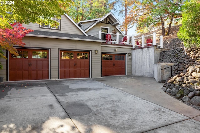 garage with concrete driveway