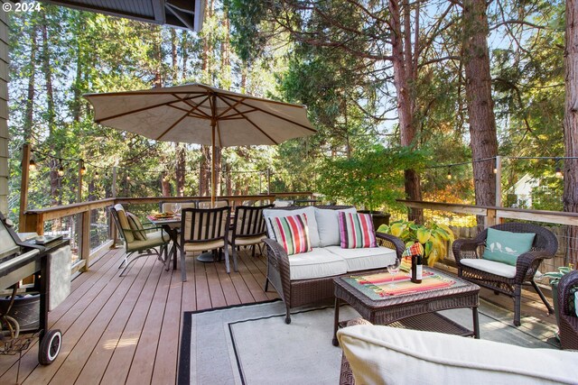 deck featuring outdoor lounge area