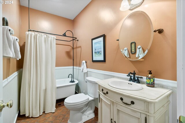 full bathroom with toilet, shower / tub combo with curtain, and vanity