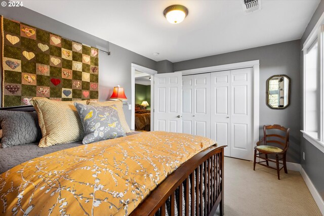 carpeted bedroom with a closet