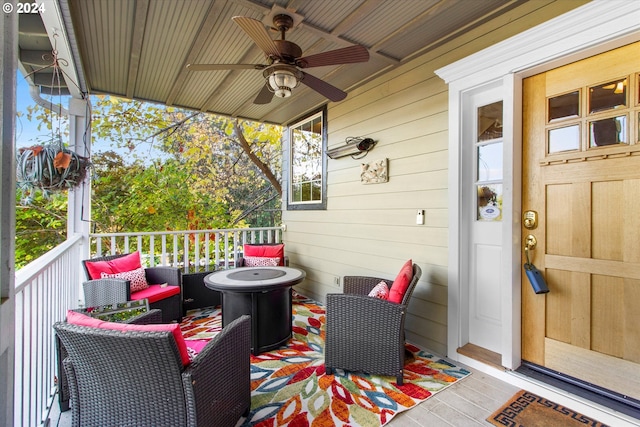 wooden terrace featuring ceiling fan