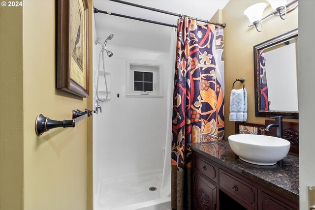 bathroom featuring vanity and walk in shower