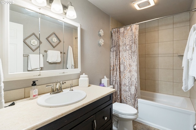 full bathroom featuring vanity, shower / tub combo, and toilet