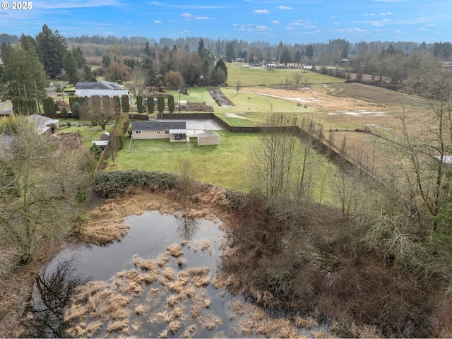 bird's eye view with a water view and a rural view