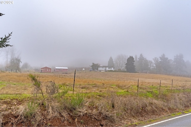 view of yard with a rural view