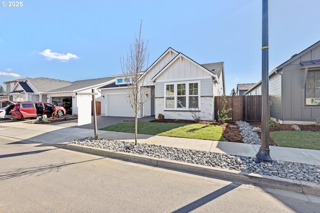 view of front of home with brick siding, board and batten siding, fence, concrete driveway, and an attached garage