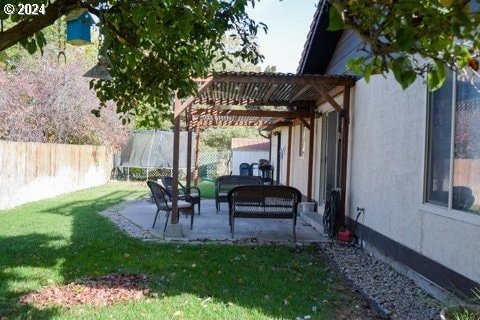 view of yard with a patio area, an outdoor hangout area, and a pergola