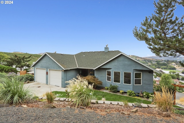 single story home with a garage