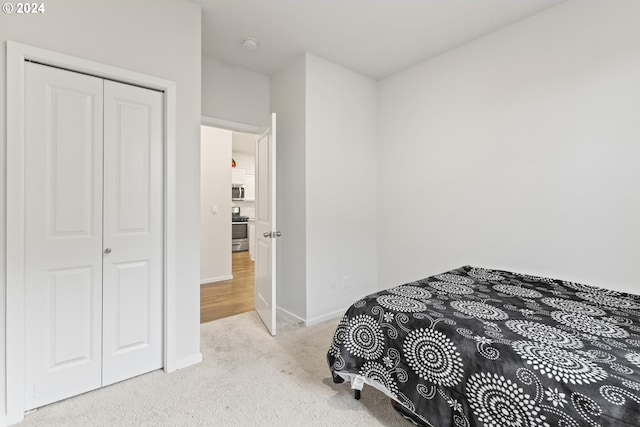 carpeted bedroom with a closet