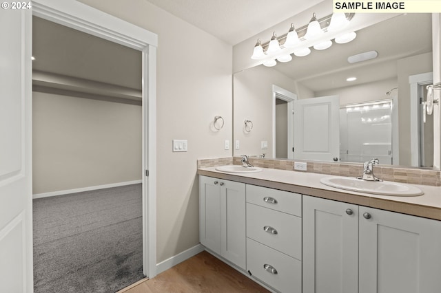 bathroom featuring vanity and a shower