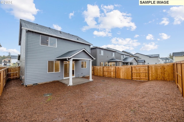 back of property with a patio