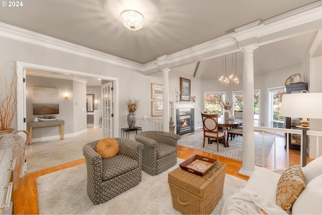317 Aker Dr, Myrtle Creek, OR 97457 - living room featuring ornate columns, a fireplace, wood finished floors, ornamental molding, and baseboards