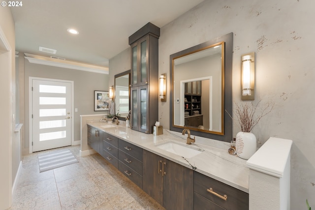317 Aker Dr, Myrtle Creek, OR 97457 - full bathroom with double vanity, baseboards, and crown molding