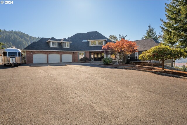 317 Aker Dr, Myrtle Creek, OR 97457 - view of front of home with concrete driveway and brick siding