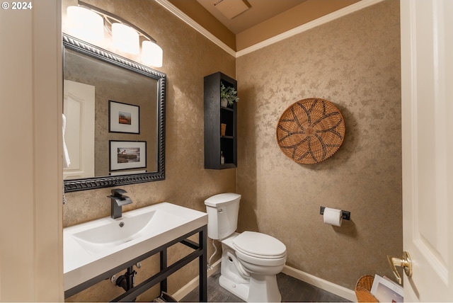 317 Aker Dr, Myrtle Creek, OR 97457 - half bathroom featuring toilet, a sink, baseboards, and ornamental molding