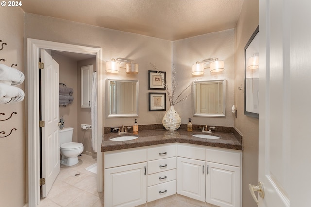 317 Aker Dr, Myrtle Creek, OR 97457 - full bath featuring toilet, tile patterned flooring, and double vanity
