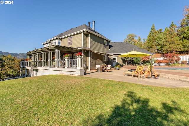 317 Aker Dr, Myrtle Creek, OR 97457 - back of property with a patio area and a lawn