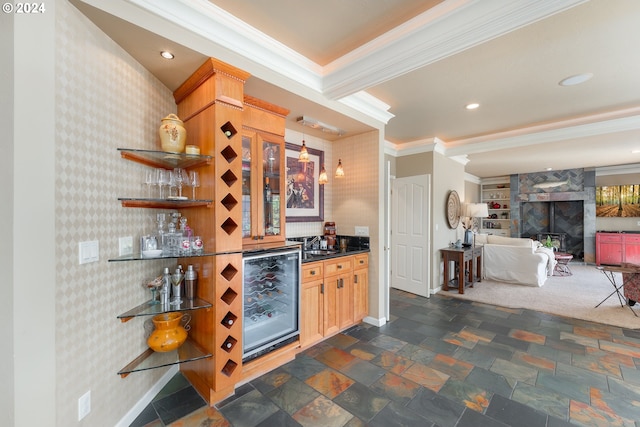 317 Aker Dr, Myrtle Creek, OR 97457 - indoor wet bar with crown molding, beverage cooler, baseboards, wallpapered walls, and dark stone finish floors
