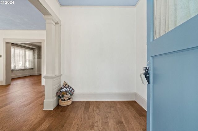 room details featuring hardwood / wood-style flooring and ornate columns