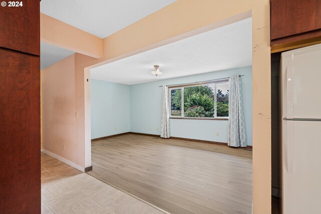 empty room with light wood-type flooring