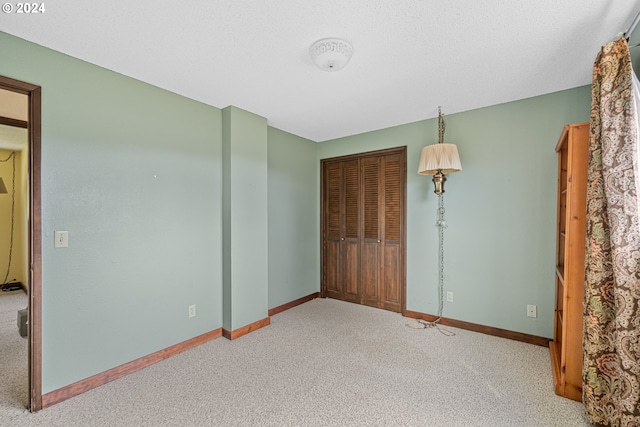 unfurnished bedroom featuring a closet and carpet