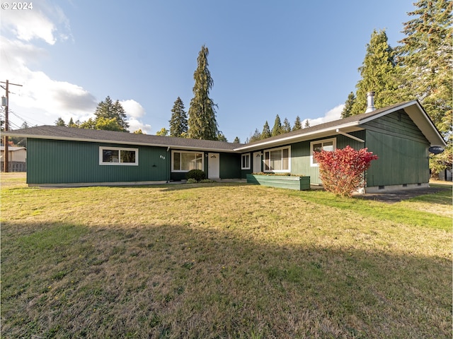 ranch-style house with a front lawn