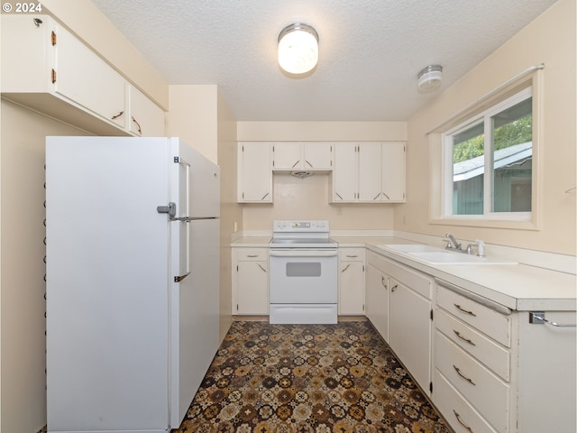 kitchen with white cabinets, a textured ceiling, sink, and white appliances