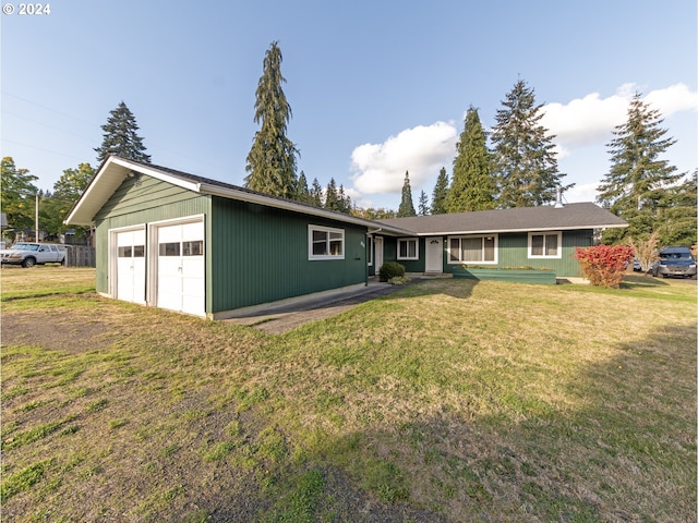 ranch-style home with a front yard and a garage