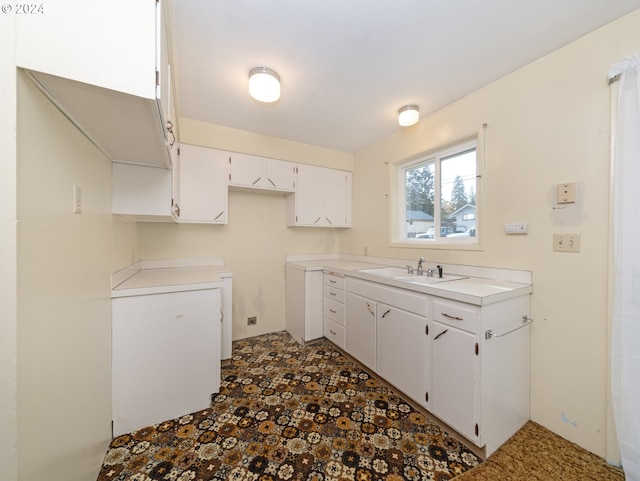 kitchen with sink and white cabinets