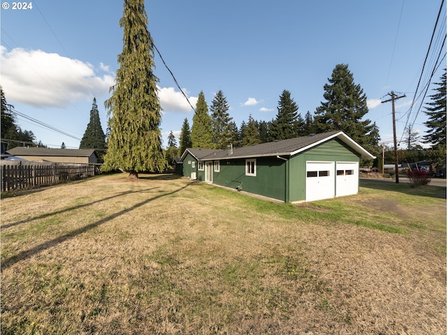 view of yard with an outdoor structure and a garage