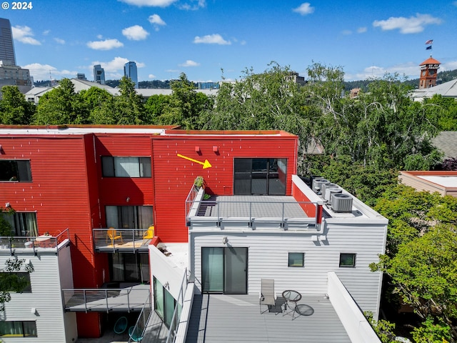 back of property with a balcony