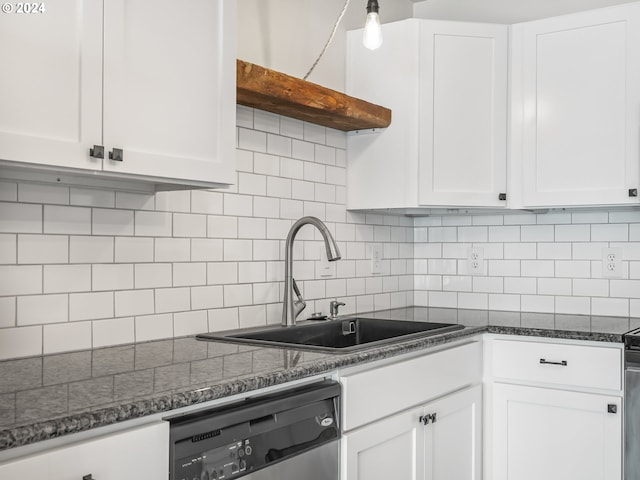 kitchen featuring dishwasher, sink, dark stone counters, decorative backsplash, and white cabinets