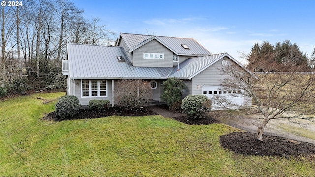 view of front of house with a garage and a front yard