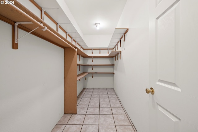 spacious closet with light tile patterned flooring