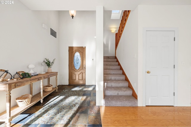 foyer entrance featuring wood-type flooring